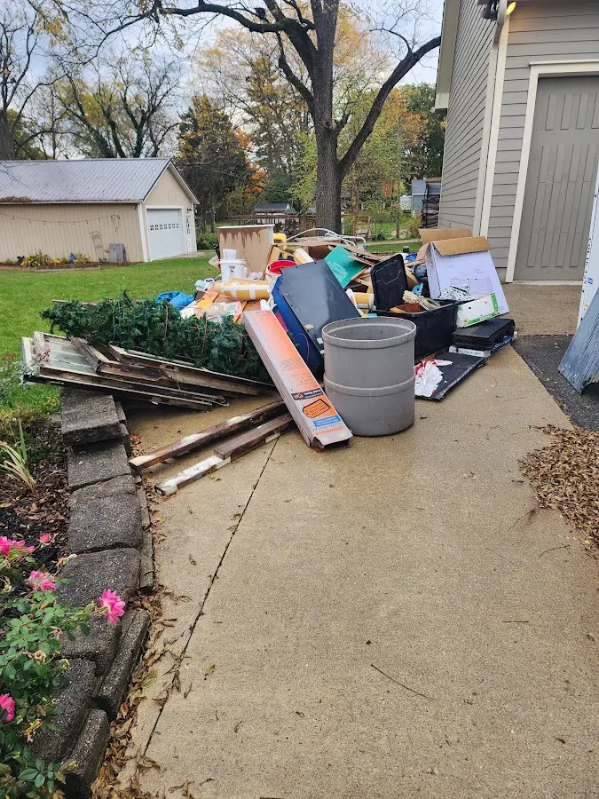 Dumpster being loaded with debris for 30 Yard Dumpster Rental in Frontenac